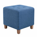 Moderner Sitzhocker Pharao mit Stoffbezug und hellen Holzbeinen in Blau